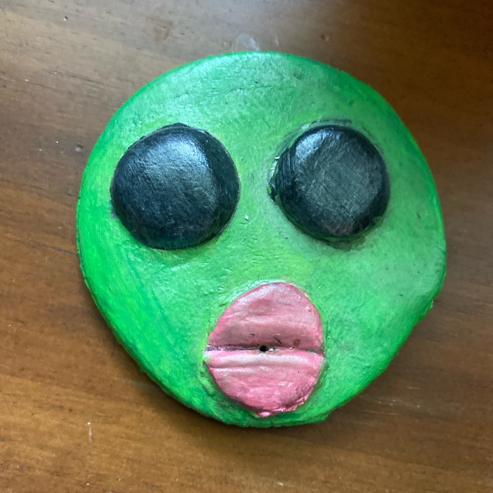Handmade green and black alien incense holder
